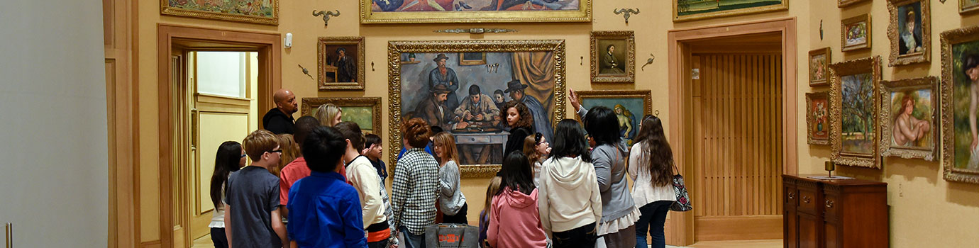 Visitors looking at a painting
